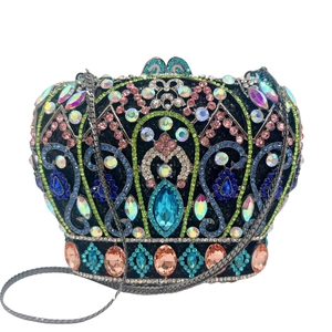Close-up of colorful rhinestones on a crown-shaped evening clutch with silver chain