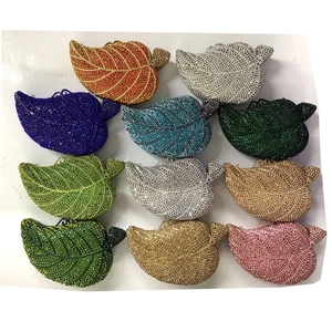 Selection of eleven colorful leaf shaped crystal clutch bags for evening gala events