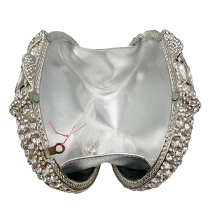 Elegant silver metal evening clutch bag with sparkling rhinestones and magnetic closure