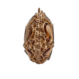 Luxurious egg-shaped evening clutch bag with amber stones and rose gold metal frame