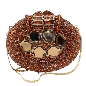 Detailed macro of vintage evening bag with amber rhinestones and large gemstones