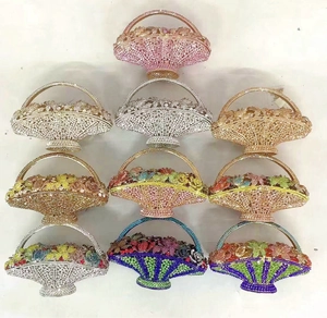 Detailed row of luxury basket clutch bags with sparkling rhinestones in various colors