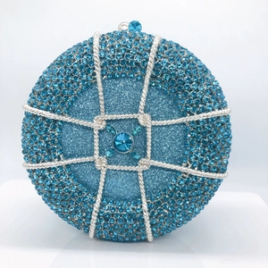 Detail of blue rhinestone evening bag with silver mesh and large crystal clasp