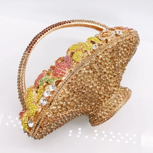 Macro shot of luxury basket clutch showing multi-color floral rhinestones and gold texture