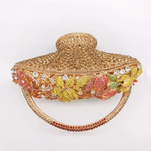 Detailed close-up of golden rhinestone evening bag with vibrant floral crystal patterns