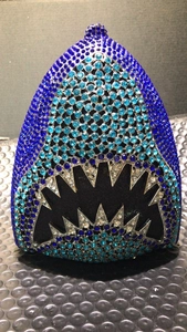 Detailed view of the sparkling blue rhinestone shark-shaped evening clutch with crystal teeth