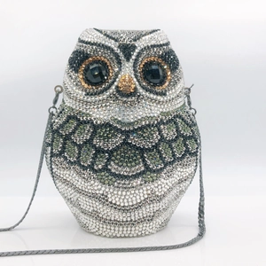 Sparkling owl-shaped evening clutch bag fully encrusted with green and white rhinestones