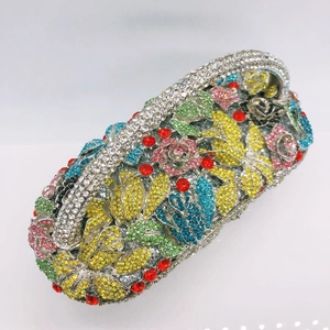 Detailed close-up of colorful floral rhinestone pattern on an oval basket clutch bag