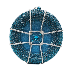 Macro shot of blue rhinestone evening bag with silver metal mesh and gemstone clasp