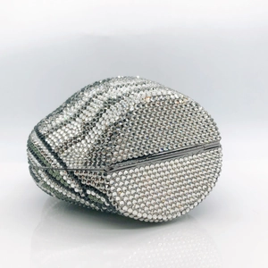Detailed view of the sparkling silver and green rhinestones on the football clutch bag