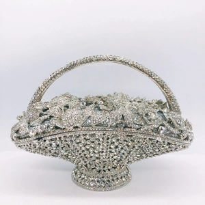 Macro shot of silver basket clutch showing intricate floral rhinestone and crystal details