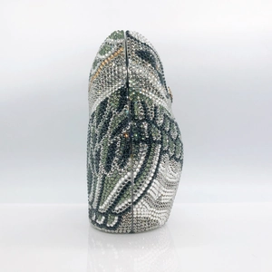 Detailed side view showing colorful rhinestones and texture of the owl clutch bag