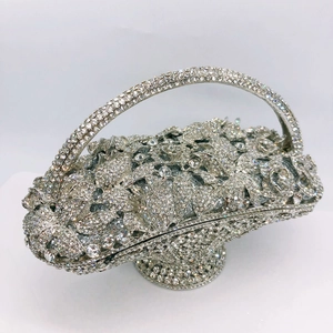 Close-up of luxury basket evening clutch with silver crystal floral and vine patterns