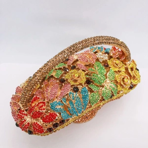 Macro view of crystal encrusted evening bag with colorful floral rhinestone patterns