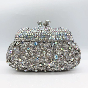 Luxury silver flower crystal clutch bag with detailed diamond floral pattern for parties