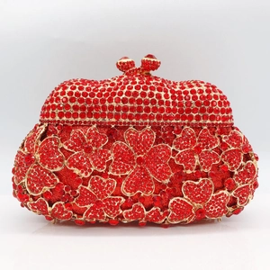 Detailed view of red crystal clutch bag with clover pattern and ruby-style clasps