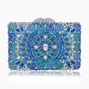 Macro detail of luxury evening clutch with blue mandala rhinestone crystals and heart clasp