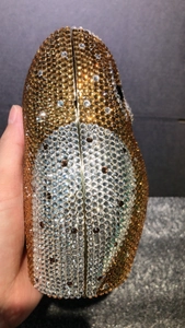 Detailed view of the luxury owl clutch showing dense rhinestone crystals and gold metal frame