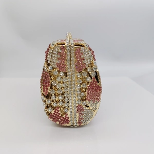 Elegant egg-shaped evening clutch bag with pink and white rhinestones and gold frame