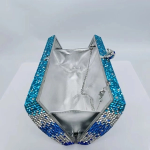 Luxurious evening clutch bag with blue and silver rhinestones and silver metal chain
