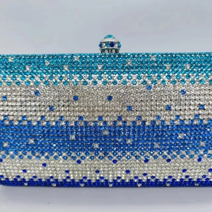 Sparkling crystal evening clutch bag with blue and white gradient rhinestone stripes