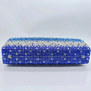 Detail of blue and silver wavy rhinestone pattern on a rectangular metal clutch bag