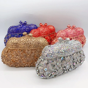 Collection of crystal evening clutch bags in multiple colors with shiny rhinestone floral patterns