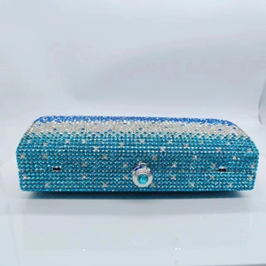 Macro detail of rectangle clutch bag with silver to royal blue gradient rhinestones