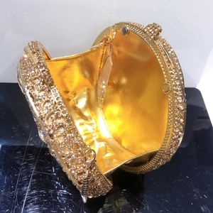 Luxurious round champagne gold crystal clutch bag with metal chain and polished interior