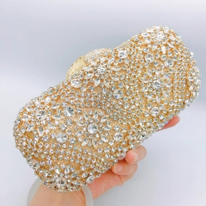Luxurious champagne gold evening clutch bag with sparkling floral rhinestone patterns