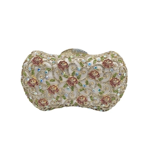 Luxury gold hollow metal evening clutch with floral rhinestones on beige satin base