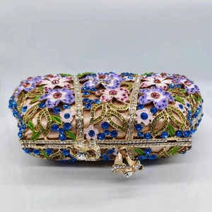 Champagne satin evening bag with golden floral metal frame and colorful rhinestones