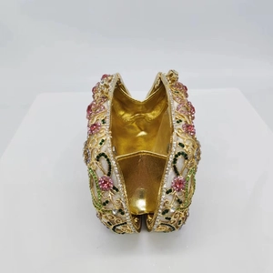 Golden cutout evening minaudiere bag with multicolor rhinestones and floral vine pattern