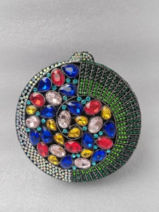 Detailed view of the colorful crystal encrusted circular clutch evening bag