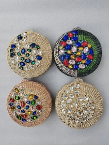 Detailed grid of crystal evening minaudières featuring multicolored gemstones and rhinestones