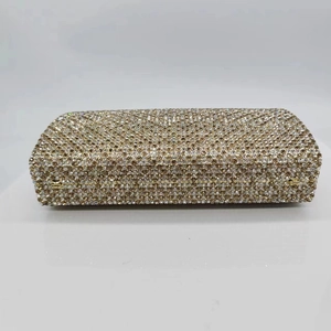 Sparkling crystal evening clutch bag with champagne rhinestones and gold metal frame