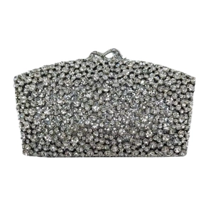 Silver rectangle evening clutch with all-over crystals and a knot-shaped metal clasp