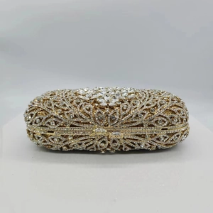 Golden hollow metal evening clutch bag featuring a luxurious floral rhinestone pattern