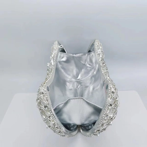 Hollow silver metal evening clutch bag with sparkling crystals and silver leather lining
