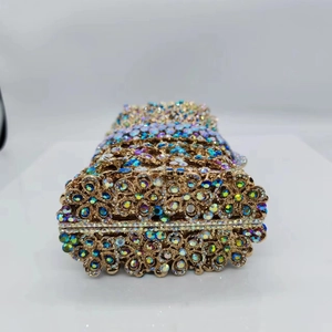 Luxurious gold crystal clutch bag with colorful rhinestones and floral metal hollow design