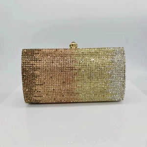 Macro shot of gradient rhinestone evening clutch bag with sparkling crystal surface