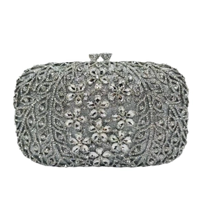 Silver luxury evening clutch bag featuring intricate crystal floral patterns and metal clasp