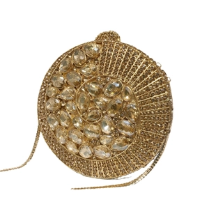 Luxurious gold round evening clutch with sparkling crystals and a fine metal chain