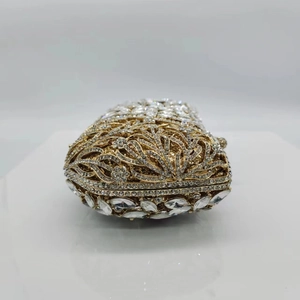 Luxury gold hollow metal clutch with crystal leaf patterns for evening parties