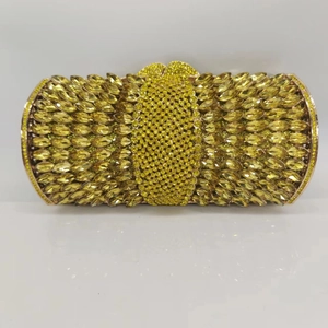 Macro shot of luxury yellow rhinestone clutch with marquise-cut crystals and gold lock