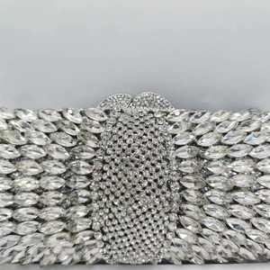 Close-up of silver rhinestone clutch with marquise crystals and heart-shaped clasp