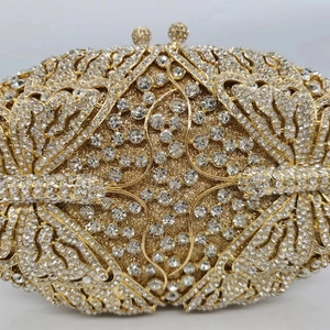Elegant gold butterfly evening clutch bag encrusted with crystals for formal parties
