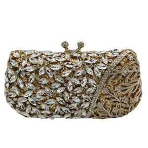 Luxurious gold crystal clutch bag with leaf patterns and sparkling diamond embellishments