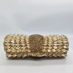 Detailed view of luxury gold evening clutch with marquise rhinestones and crystals