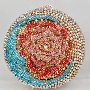 Round evening clutch bag with multi-colored floral rhinestones and vintage metal clasp